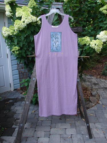 1997 River Journey Dress Sea Coral Jasmine Altered Size 1 hanging on a clothesline, showcasing its scoop neckline, slimmer shape, and side hem alterations.