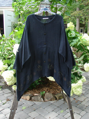 1998 Limited Edition Gauze Orchard Jacket Nature Raven Size 2 displayed on a wooden stand, showcasing its wide banded A-line shape, rounded button front, and unique curved inset seams.