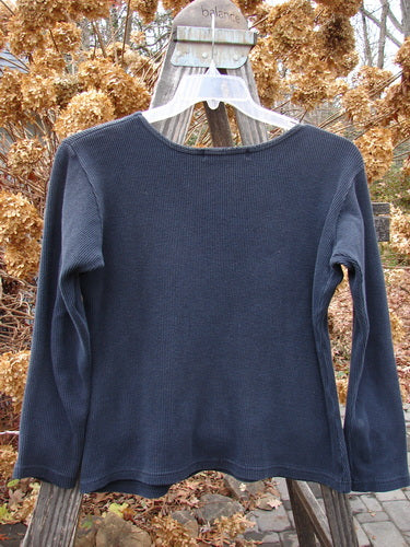 1997 PMU Patched Thermal Long Sleeved Top on a swinger, featuring a balance device.