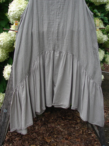 Barclay Gauze Batiste Summer Frock Jumper in stripe sand stone, size 1, with a softly crinkled gauze-batiste texture and a loose, tiered silhouette. The gray-beige fabric falls in a gathered hem with a lightweight, airy drape.