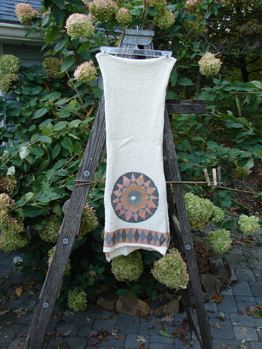 1991 Limited Edition Chenille Knit Scarf Medallion Natural OSFA draped on a wooden ladder, featuring unique medallion accents and loosely knit cotton chenille texture, embodying Bluefishfinder's vintage style.