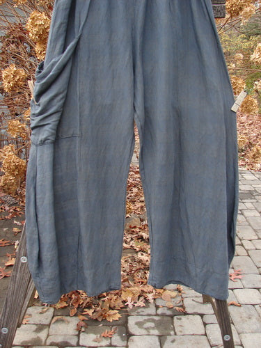 Barclay Linen Rayon Pepper Pant on pole, with pockets, on brick surface. Generous hip measurements, drop flop pocket, unique colorway.
