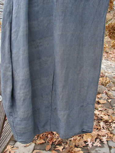 Barclay Linen Rayon Pepper Pant on bench, leaves in background.