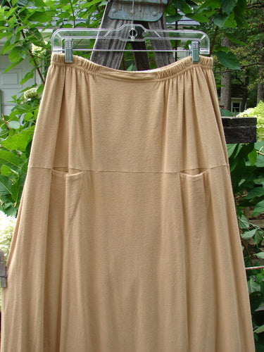 1998 Scrabble Skirt Games Bamboo Size 2 hanging on a clothesline, showcasing its flat folded front, rear elastic waistband, horizontal panels, and two upper pockets.