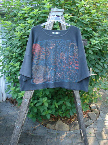Barclay Thermal Boxy Crop Top Windy Garden Raven OSFA displayed on a rack, featuring a rounded neckline, crop length, and three-quarter sleeves with a unique garden theme, exemplifying Blue Fish Clothing's vintage style.