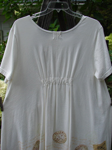 2000 NWT June Straight Duo Postage White Size 2 featuring a white A-line dress with a front pouch pocket and a matching straight skirt, displayed on a hanger.