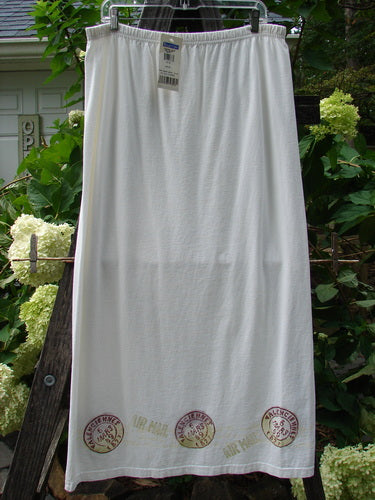 2000 NWT June Straight Duo Postage White Size 2, featuring a white organic cotton dress and matching skirt, hung on a clothesline, highlighting the skirt's elastic waistband and the dress's front pouch pocket.