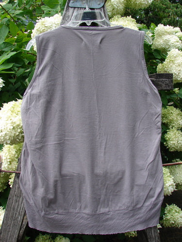 Barclay Flutter Bottom Tank Top Moon Bird in stone plum, size 2, shown from the back with a sleeveless cut, rounded neckline, and softly flared hem. The lightweight fabric has a smooth, slightly wrinkled finish and a muted gray-plum tone.