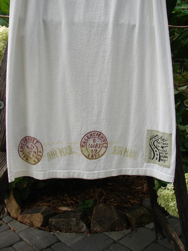 2000 NWT June Straight Duo Postage White Size 2 featuring a white towel with red stamp designs, showcasing its postage theme detailing and organic cotton material.