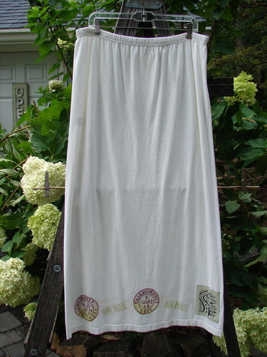 2000 NWT June Straight Duo Postage White Size 2, featuring a white skirt with elastic waistband hanging on a clothesline outdoors.