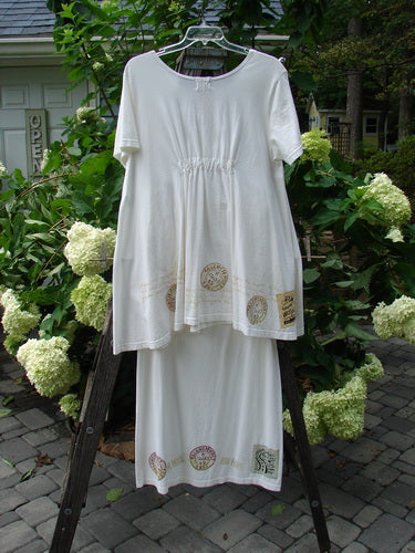 2000 NWT June Straight Duo Postage White Size 2: Organic cotton dress with elastic tabbed back, front pouch pocket, postage theme paint, and matching straight skirt with elastic waistband and hem detailing.