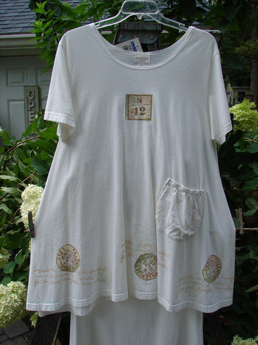 2000 NWT June Straight Duo Postage White Size 2 dress with a rounded neckline, front pouch pocket, postage theme paint, and signature Blue Fish patch.