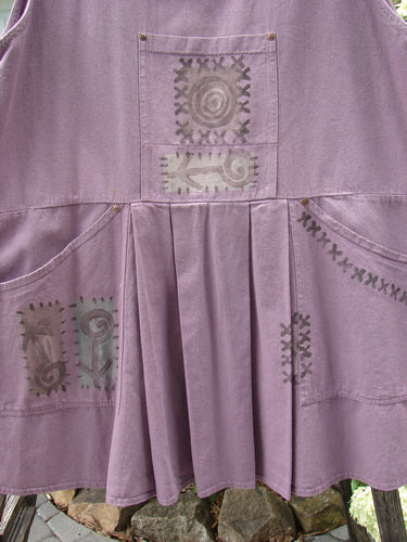 1995 Denim Invention Smock Modern Lolly Flower Heliotrope OSFA, featuring front pleats, a front bib pocket, side pockets with metal rivets, and a wide A-line shape with back painted tunnel pocket.