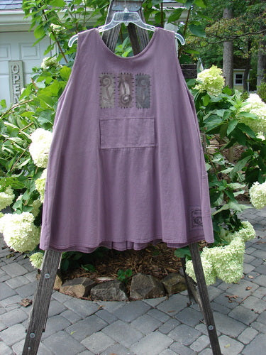 1995 Denim Invention Smock Modern Lolly Flower Heliotrope OSFA: A purple tank top with front pleats, a front bib pocket, two lower scooped side pockets, and a back painted tunnel pocket.