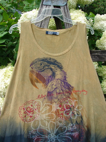 Barclay Round Bottom Tunic Tank Top Parrot Mottled Golden Sunset, size 0, in a muted golden tan with a faded parrot graphic and floral motifs. The sleeveless tunic has a scoop neckline, soft worn-looking fabric, and a darker mottled hem.