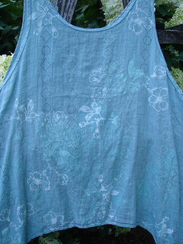 Barclay Linen Altoll Top Falling Floral Sage Size 2, a sleeveless sage linen top with a soft, sheer texture and faded floral print. The loose, rounded silhouette fills the frame, with delicate stitched trim and airy drape.