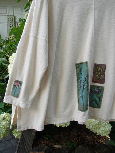 2000 Patched Resort Sweatshirt Nature Dove Size 2, featuring painted nature-themed patches, A-line billowy full swing, vented sides, double-paneled V neckline, drop shoulders, and Blue Fish signature patch.
