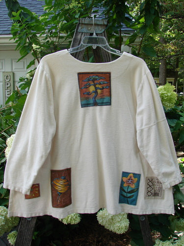 2000 Patched Resort Sweatshirt Nature Dove Size 2 featuring a nature-themed painted patch of a tree, drop shoulders, vented sides, and a double-paneled V-shaped neckline.