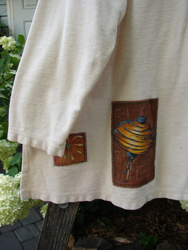 2000 Patched Resort Sweatshirt Nature Dove Size 2 featuring nature-themed painted patches, vented sides, and a unique double-paneled V-shaped neckline. Made from heavyweight cotton fleece flannel.