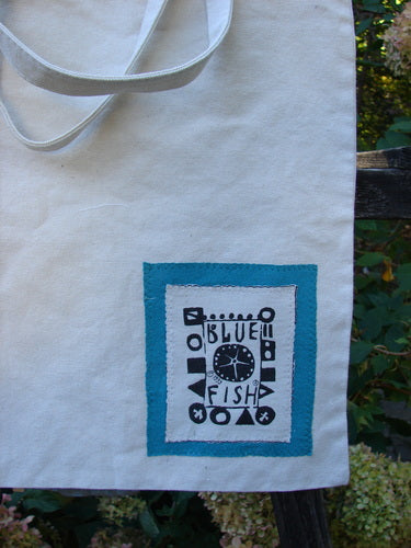 2000 PMU Patched Cotton Canvas Pocket Tote Promo Natural One Size featuring blue fish patch, white strap, and colorful accents, crafted from organic cotton canvas, highlighting sustainable vintage design by Jennifer Barclay.