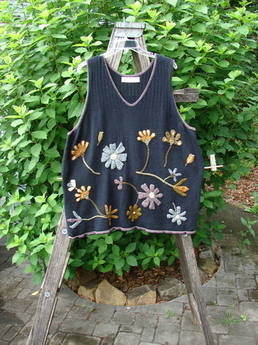 1998 Limited Edition Peruvian Embroidered Sweater Vent Tunic Floral Vine Black OSFA features detailed floral embroidery and contrasting stitching, a varying hemline, yarn-covered buttons, and side vents on a soft cotton knit.