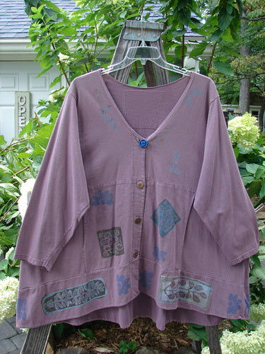 1993 Modernismo Cardigan Nature Plum Wine Size 2, featuring blue floral patterns, old-timey buttons, front kangaroo pockets, A-line wide rounded swing, and a thicker banded hemline.