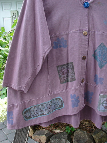 1993 Modernismo Cardigan Nature Plum Wine Size 2 with a patchwork design, two front pockets, old-fashioned buttons, and a wide rounded swing, displayed on a clothes hanger.