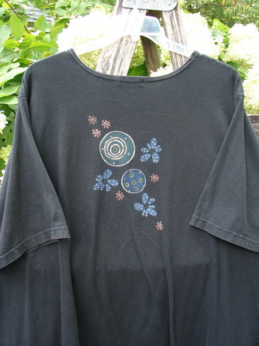 Barclay Short Sleeved Studio Tee Magic Moon Cloud in black, size 3, with a loose short-sleeved silhouette and a centered cluster of circular moonlike and floral motifs in blue, white, and pink on soft matte cotton.