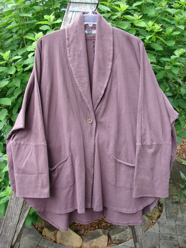 Barclay Reprocessed Golden Hour Deco Jacket features a dense cotton fabric with a deep V-neckline, drop dolman shoulders, ribbed sleeves, and diagonal raw-topped pockets, embodying Bluefishfinder.com's vintage style.
