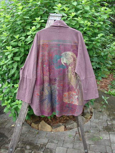 Barclay Reprocessed Golden Hour Deco Jacket Rear Parrot Plum Wine OSFA displayed on a wooden ladder, highlighting its unique design with drop dolman shoulders, oversized pockets, and a deep V-shaped neckline.