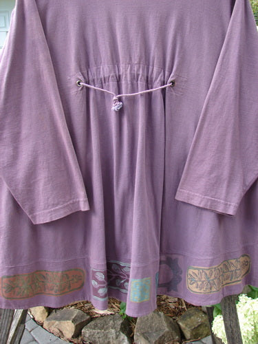 1993 Modernismo Pullover Cardigan Nature Plum Wine Altered Size 2 displayed on a clothes rack, showcasing its A-line swing, front kangaroo pockets, and decorative old-fashioned buttons.