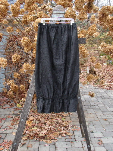 2000 Shaunting Crushed Silk Skirt, black, size 2, on a rack.