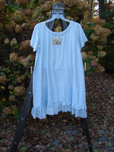 Magnolia Pearl Voile Tie Neck Peasant Tunic Crystal Blue OSFA: A dress with ribbon tie neckline, fluttery ruffle edge, and love theme patch.