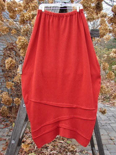 2000 Thermal Awen Skirt, Bittersweet, Size 2: Full bell-shaped red skirt with textured diagonal hemline and interesting folds of fabric.