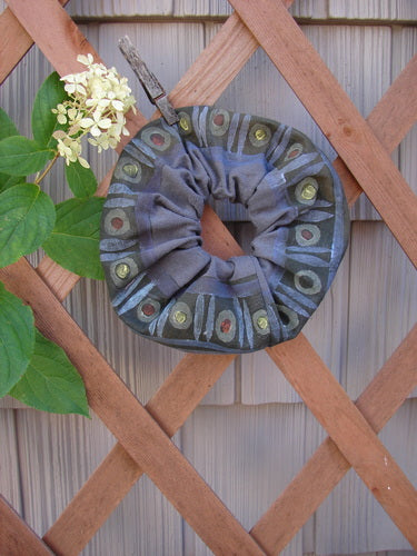 1996 PMU Organic Cotton Hair Scrunchie Abstraction Mirror One Size, featuring ruffled fabric with abstract patterns, displayed on a wooden lattice, showcasing vintage-inspired design from Bluefishfinder.com.