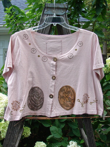 1993 Travel Top Oval Gardens Dried Rose Size 1 featuring brown oval designs, a deeply scooped neckline, crop shape, and button accents, perfect for layering and pairing with other Blue Fish pieces.