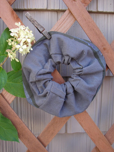 1996 PMU Organic Cotton Hair Scrunchie Abstraction Mirror One Size displayed on a wooden fence, featuring ruffled fabric and thin elastic, representing Bluefishfinder.com's commitment to sustainable vintage fashion.