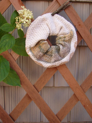 1994 PMU Cotton Knit Hair Scrunchie Garden Path Natural One Size displayed on a wooden lattice, showcasing its ruffled fabric and thin elastic band, embodying Bluefishfinder.com's commitment to sustainable vintage fashion.