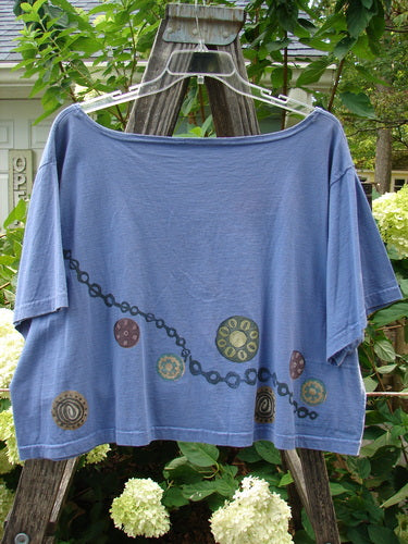 1993 Travel Top Pinwheel Periwinkle Size 2 featuring a chain and pinwheel theme with ceramic glazed buttons, scooped neckline, crop shape, and a Blue Fish 93 patch on the back.