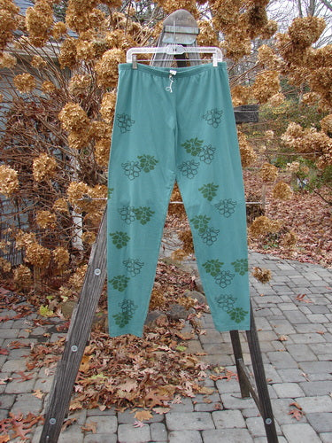 Barclay Relaxed Legging in Moss Green, cotton-lycra blend, longer leg, relaxed fit, orchid theme paint, soft and forgiving feel. Size 2.