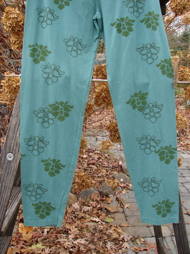 Barclay Cotton Lycra Relaxed Legging Orchid Moss Green Size 2 ai, featuring an orchid-themed pattern on a pair of pants.