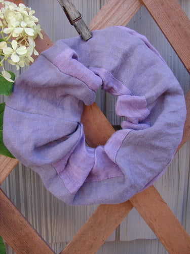 Barclay PMU Silk Linen Hair Scrunchie Unpainted Lavender displayed on a wooden fence, showcasing its ruffled texture and thin elastic band, embodying Bluefishfinder.com's vintage, sustainable fashion ethos.