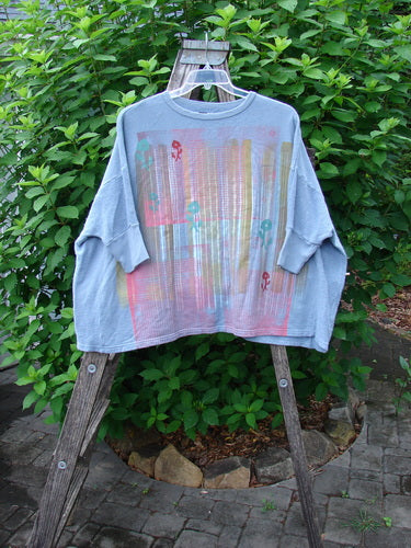 Barclay Hemp Cotton Banded Sleeve Colors Sweatshirt Grid Flower Peacock OSFA, showcasing a wide, boxy shape with dolman sleeves and contrasting side panels, emphasizing a distinctive floral grid pattern.