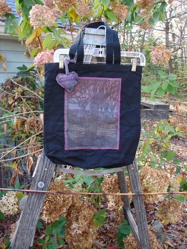 1994 PMU Patched Tote Bag Forest Walk Black One Size, featuring a vibrant purple and pink design on black canvas, displayed on a wooden ladder, showcasing its long straps and gusseted bottom.