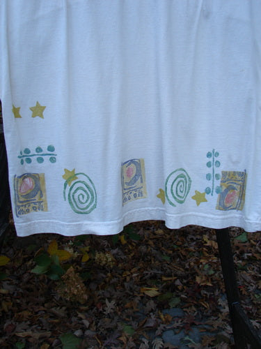 1992 Little Storma Dress Moon White OSFA: White towel with pattern, black pole in background. Mid weight cotton, deep rounded neckline, rear ribbon slits, celestial moon patches, Blue Fish vintage patch. Bust 42, waist 42, hips 44, length 36 inches.