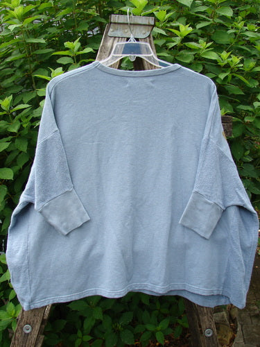 Barclay Hemp Cotton Banded Sleeve Colors Sweatshirt Grid Flower Peacock OSFA displayed on a swinger, showcasing its wide boxy shape, dolman banded sleeves, and contrasting textured side panels.