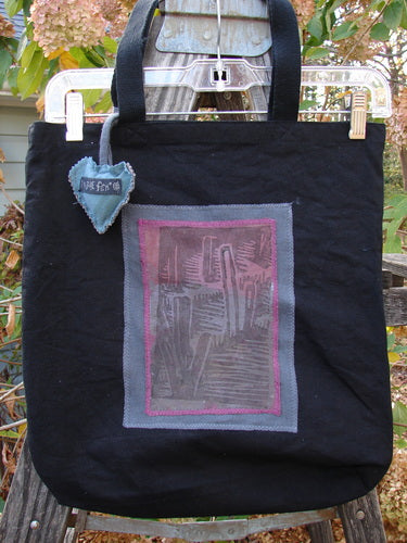 1994 PMU Patched Tote Bag Wood Path Black One Size: A black tote with a vibrant patch design, featuring extra long straps and a gusseted bottom, celebrating sustainable vintage fashion.