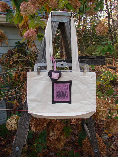 1995 PMU Patched Tote Bag Sling Vintage Logo Frayed Natural Pink One Size, featuring a prominent pink square patch with a letter 'W', long shoulder straps, and a gusseted bottom.