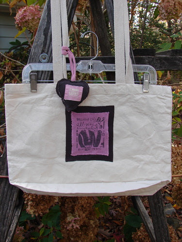 1995 PMU Patched Tote Bag Sling Vintage Logo Frayed Natural Pink One Size, featuring a purple and black patch, long shoulder straps, and a puffy heart accent, crafted for sustainability.