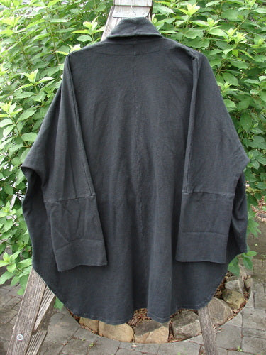 Barclay Reprocessed Golden Hour Deco Jacket Unpainted Black OSFA, featuring a unique flowing design with a deep V-neckline, drop dolman shoulders, and oversized diagonal pockets, crafted from heavyweight organic cotton.